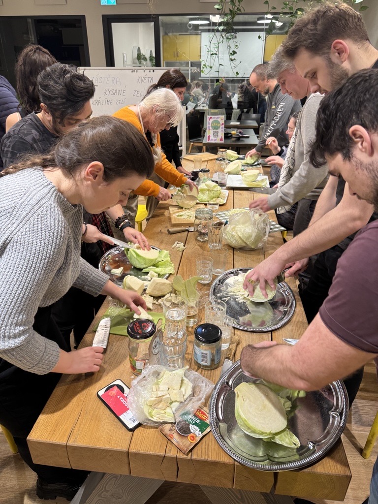 Students preparing food together during a community class activity